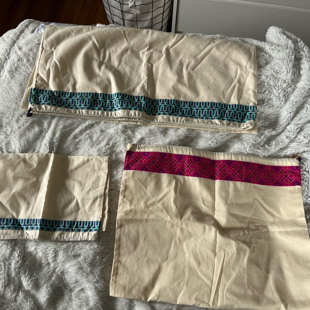 Three Tory Burch dust bags